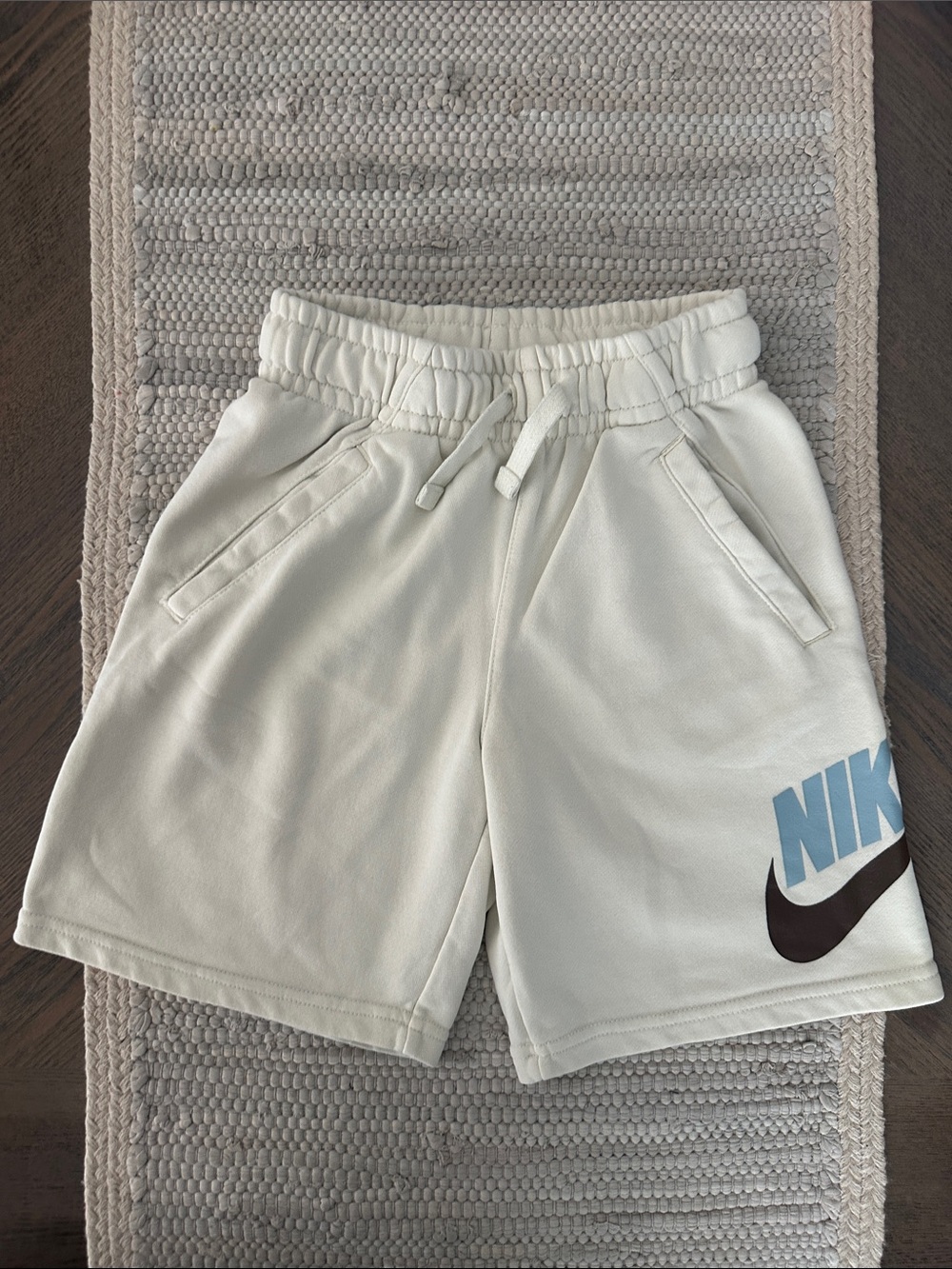 Nike Cream Shorts with Blue and Brown Logo